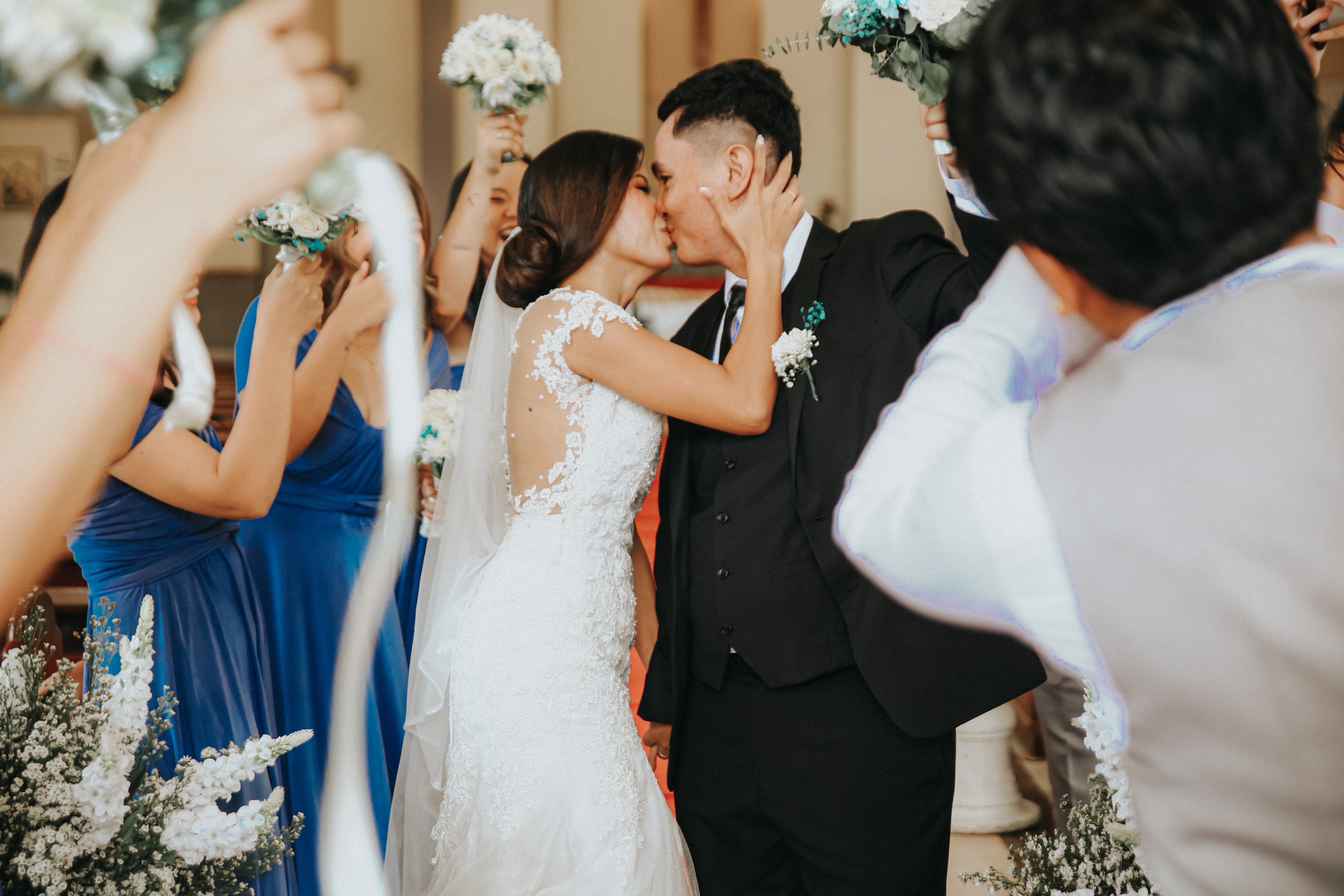 Bride walking the aisle with her father, seaside background
